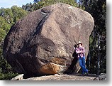 Brett posing against boulder near the Orroral Geodetic Observatory