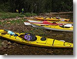 Some of the kayaks on the bank during a break