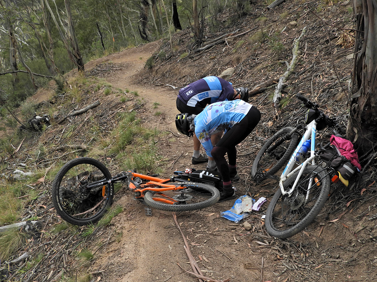 Karen helping Graeme after a fall on the Thredbo Valley Track