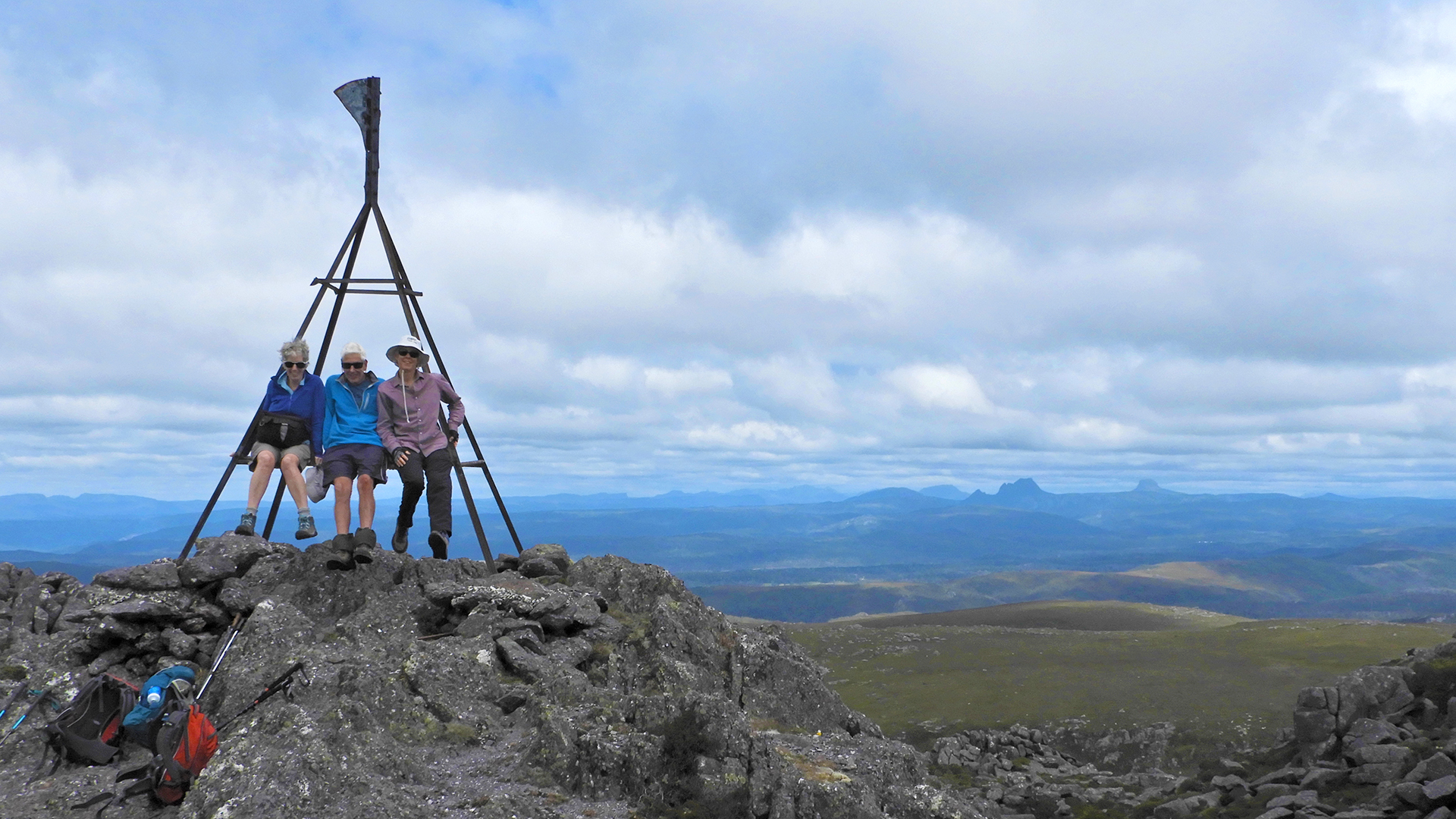 Gill, John and Karen on top of Black Bluff with Cradle Mountain in the distance