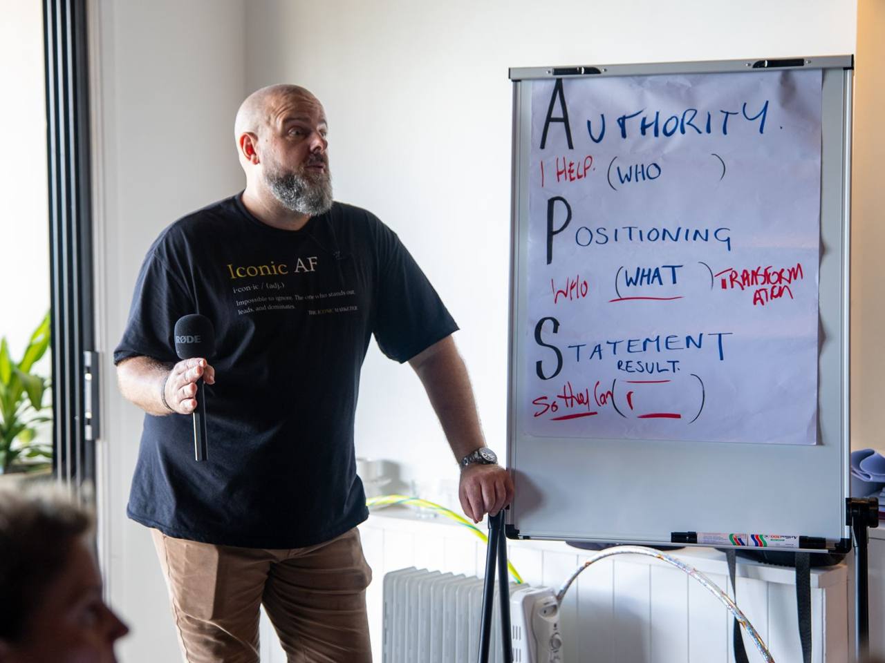 Brett Davis teaching at a flipchart